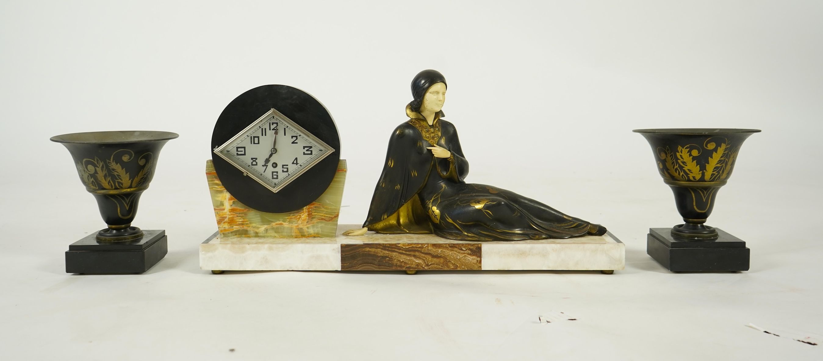 Attributed to Uriano (Ugo Cipriani, Italian, 1897-1960), a French Art Deco marble clock garniture
